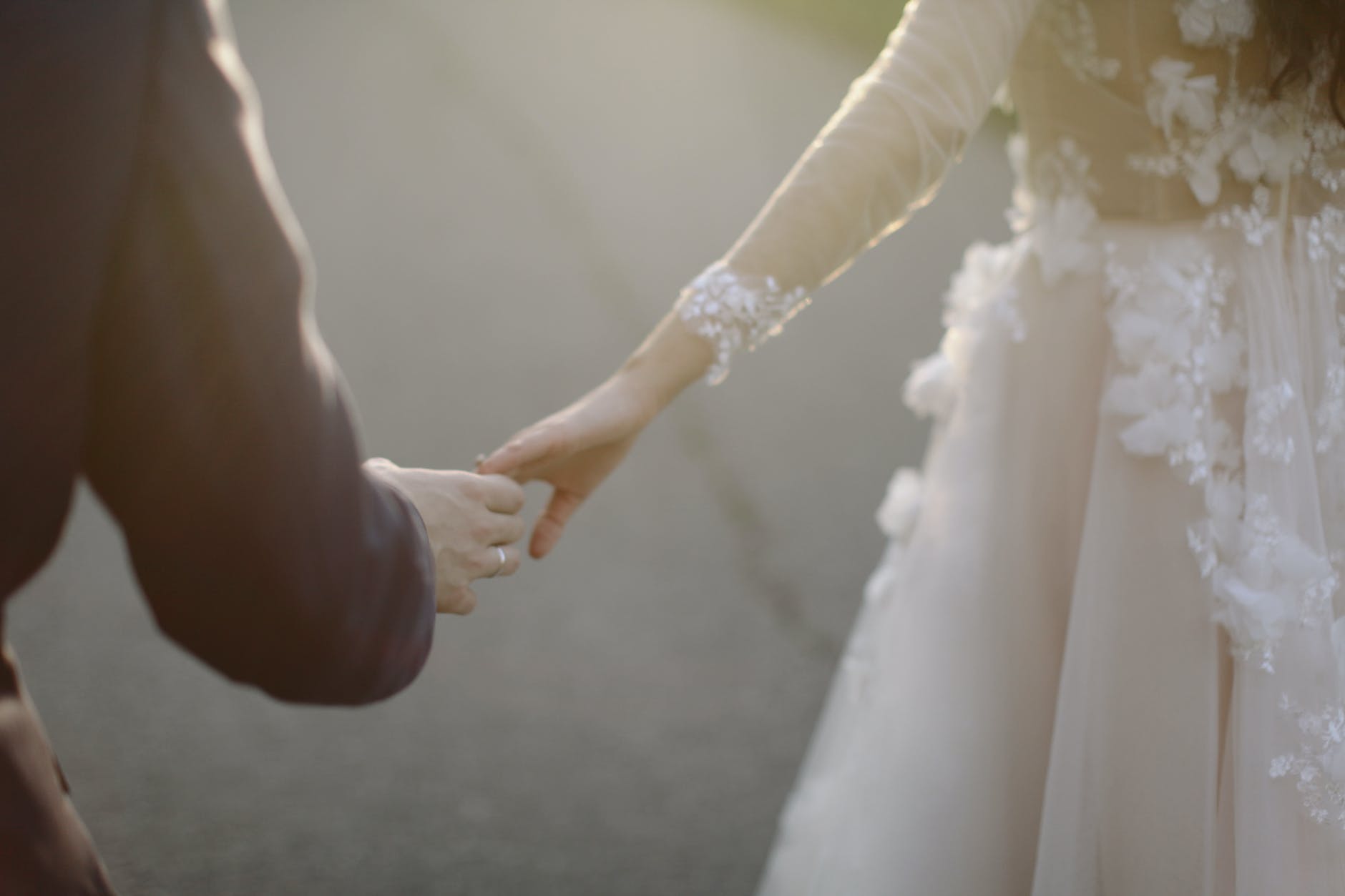 newlyweds holding hands